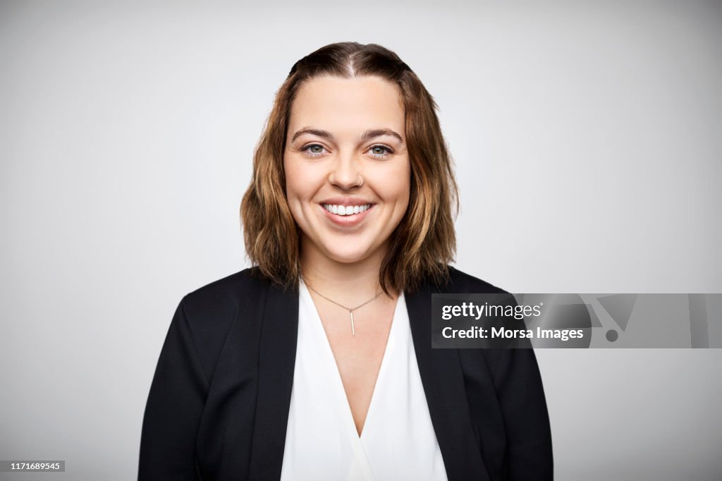 Portrait of smiling mid adult female entrepreneur