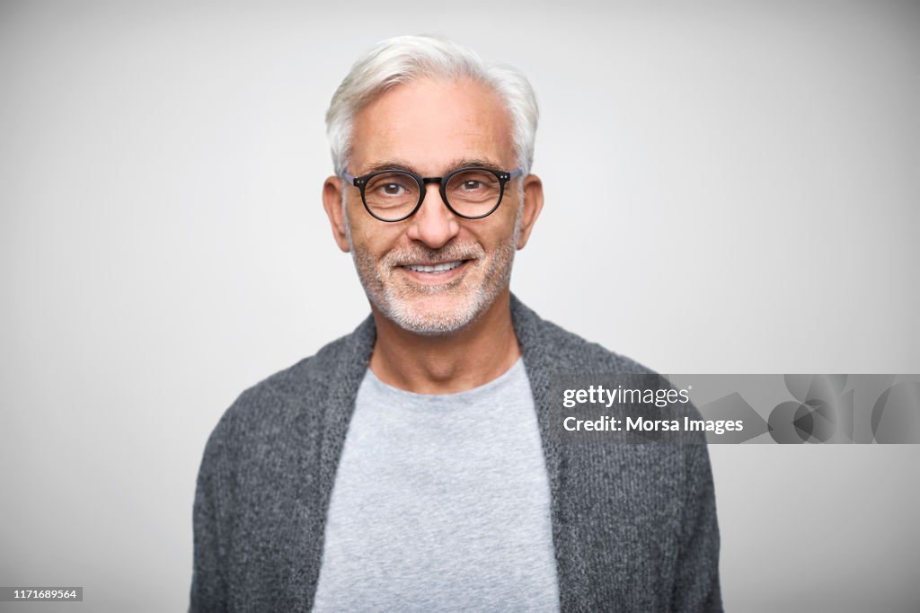 Senior owner wearing eyeglasses and smart casuals