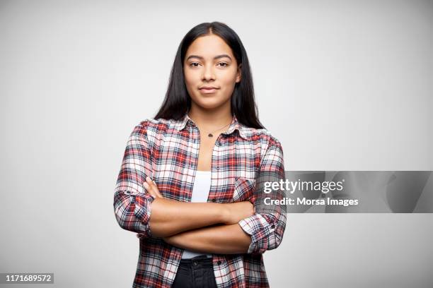 portrait of female entrepreneur with arms crossed - checked shirt stock-fotos und bilder