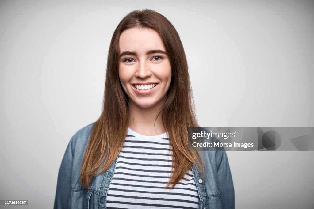 Portrait of smiling businesswoman wearing denim