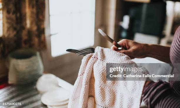 woman drying dishes - pano da cozinha imagens e fotografias de stock