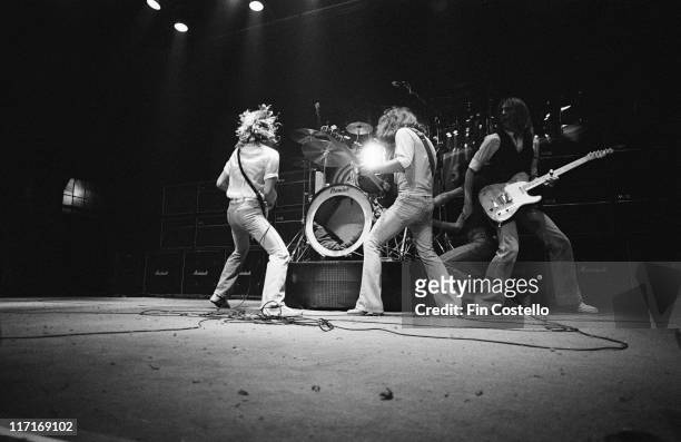 Status Quo , British rock band, on stage during a live concert performance at Granby Hall in Leicester, England, Great Britain, in December 1977.