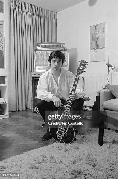 Chris Spedding, British rock and roll and jazz guitarist, posing with his guitar at home in Wimbledon, London, England, Great Britain, 1978.