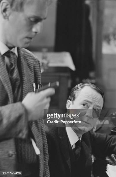 English actor Peter Sallis in character on right during filming of the episode 'A Laugh at the Dark Question' from the Associated Television drama...