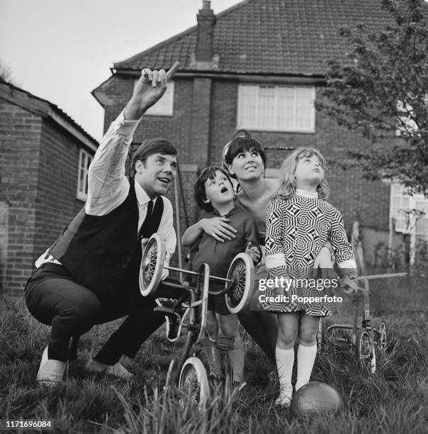 English pop singer Marty Wilde with his wife Joyce and children Ricky Wilde and Kim Wilde in the garden of their home in May 1966.