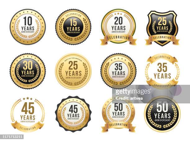 anniversary gold badge set - badge stock illustrations