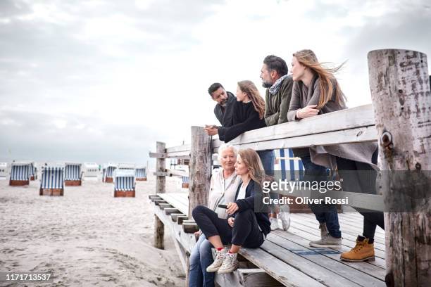 family and friends on boardwalk on the beach - german north sea region bildbanksfoton och bilder