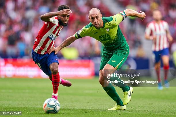 Thomas Lemar of Atletico de Madrid battle for the ball with Ivan Ramis Barrios of SD Eibar during the La Liga match between Club Atletico de Madrid...