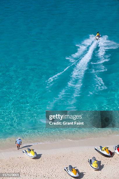 jet ski rentals at beach - nassau beach stock pictures, royalty-free photos & images