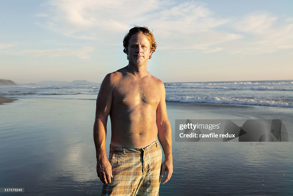 A middle aged man on a beach