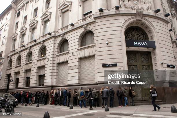 People make a long queues in front of the BBVA banck since early hours before the banks open on September 2, 2019 in Buenos Aires, Argentina....