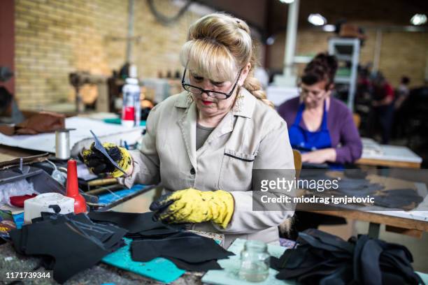 female manufacturing workers making a new shoe template - moulding a shape stock pictures, royalty-free photos & images
