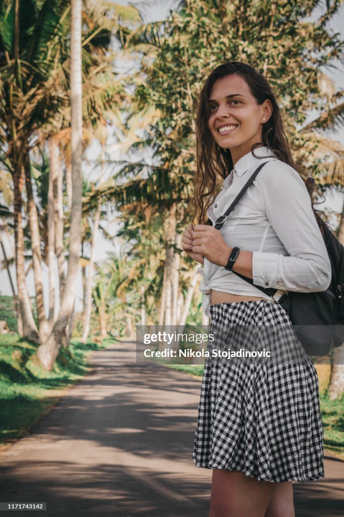 Beautiful girl visiting the Bali rice fields