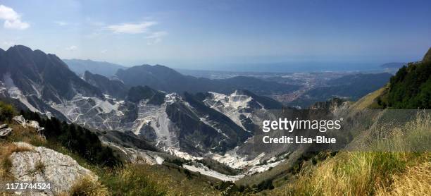panoramic view of quarries in carrara, tuscany, italy - carrara stock pictures, royalty-free photos & images
