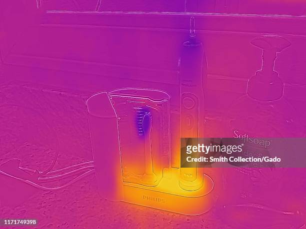 Thermal camera thermographic image, with light areas corresponding to higher temperatures, showing waste heat generated by Philips electric...