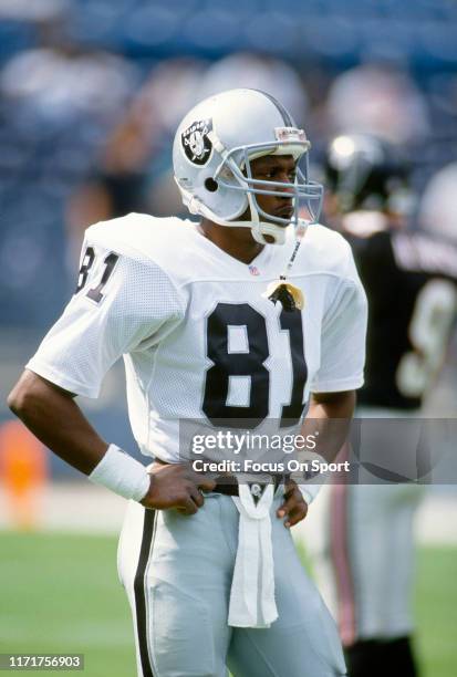 Tim Brown of the Los Angeles Raiders looks on against the Atlanta Falcons during an NFL football game September 22, 1991 at Atlanta-Fulton County...