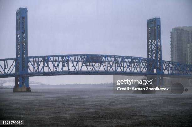 foggy main street bridge in jacksonville during heavy rain and storm. florida, usa - jacksonville stock pictures, royalty-free photos & images