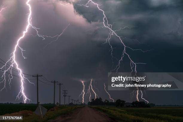 extreme lightning with fireflys lighting up farmland, nebraska. usa - tormenta de granizo fotografías e imágenes de stock