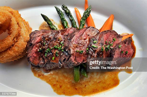 Grilled hanger steak with handmade onion rings, roasted vegetables and bordelaise sauce served at Senart's Oyster &amp;Chop House on June 10, 2011 in...