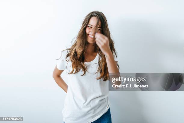 portrait of smiling woman with hairs on her face - estilo de cabelo fotografías e imágenes de stock