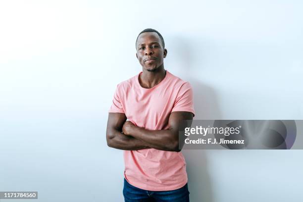 portrait of man with serious expression - arms crossed stock pictures, royalty-free photos & images