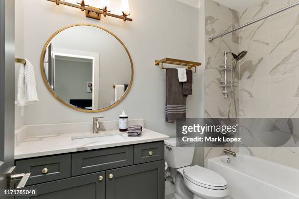 modern bathroom interior - mirror image stock-fotos und bilder