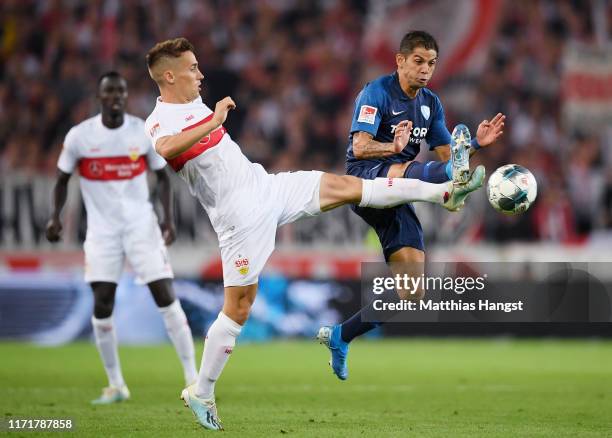 Cristian Gamboa of Bochum is challenged by Philipp Klement of VfB Stuttgart during the Second Bundesliga match between VfB Stuttgart and VfL Bochum...