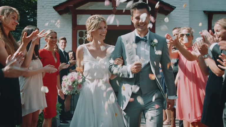https://media.gettyimages.com/id/1171792404/video/guests-throwing-petals-over-couple-outside-church.jpg?b=1&s=640x640&k=20&c=WsFekyW0LOVvPN5P2Jz3dsiDSxSgU-WClWlNkfcdPvY=