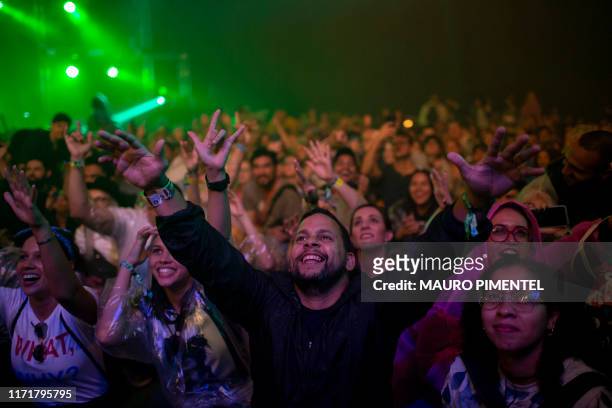 Fans enjoy the performance of Argentinian group Fuerza Bruta during the Rock in Rio festival at the Olympic Park, Rio de Janeiro, Brazil, on...