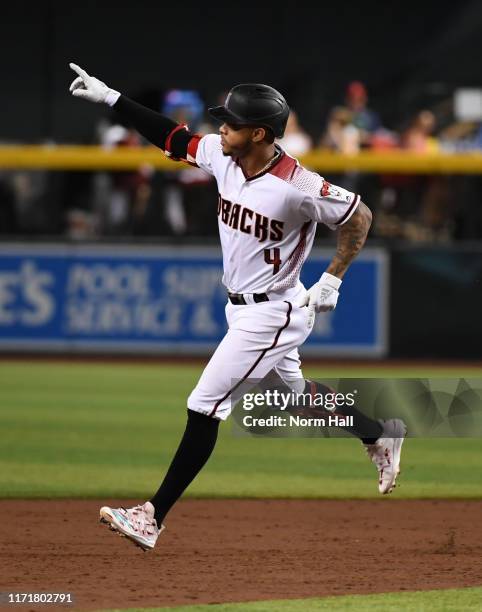 Ketel Marte of the Arizona Diamondbacks rounds the bases after hitting a two run home run off of Cal Quantrill of the San Diego Padres during the...