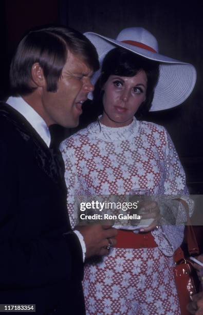 Musician Glen Campbell and Billie Jean Nunley attend Honor America Day on July 4, 1970 in Washington, D.C.