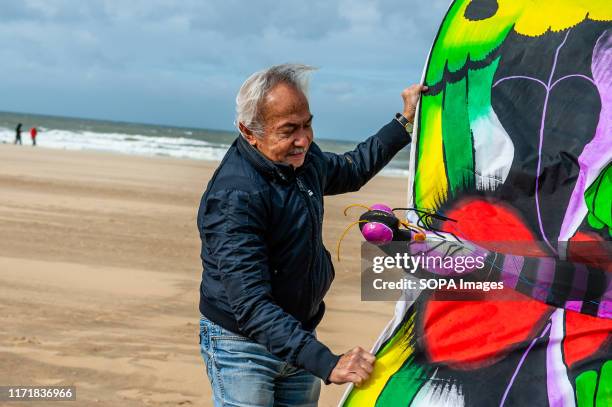 Rubens Agaatsz showing one of his kites during festival. The international Kite Festival Scheveningen makes the most of the consistent prevailing...