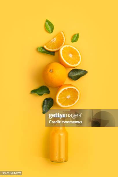 orange fruits and juice in bottle. - orangensaft stock-fotos und bilder