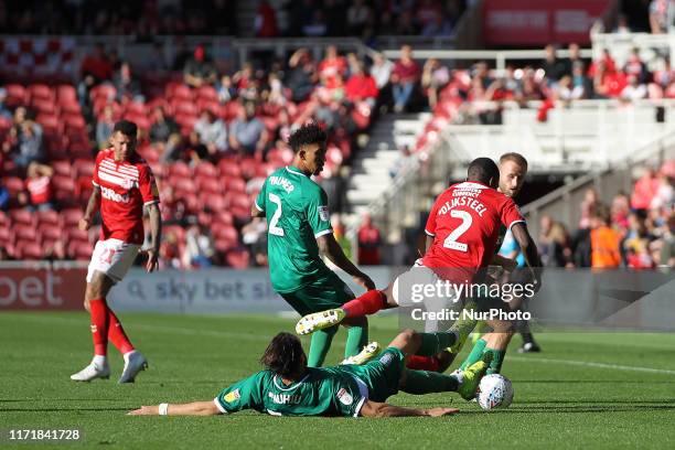 Atdhe Nuhiu of Sheffield Wednesday brings down Middlesbrough's Anfernee Dijksteel during the Sky Bet Championship match between Middlesbrough and...