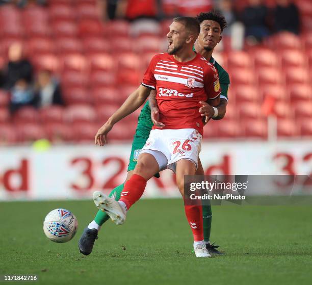 Lewis Wing of Middlesbrough and Liam Palmer of Sheffield Wednesday during the Sky Bet Championship match between Middlesbrough and Sheffield...