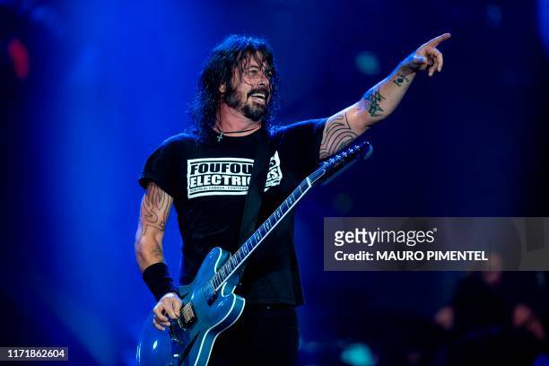 Singer and guitarist Dave Grohl of US rock band Foo Fighters performs onstage during the Rock in Rio festival at the Olympic Park, Rio de Janeiro,...