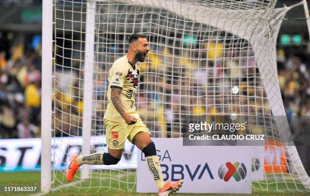 Emanuel Aguilera of America celebrates after scoring a goal during the Mexican Apertura tournament football match between Club America and...