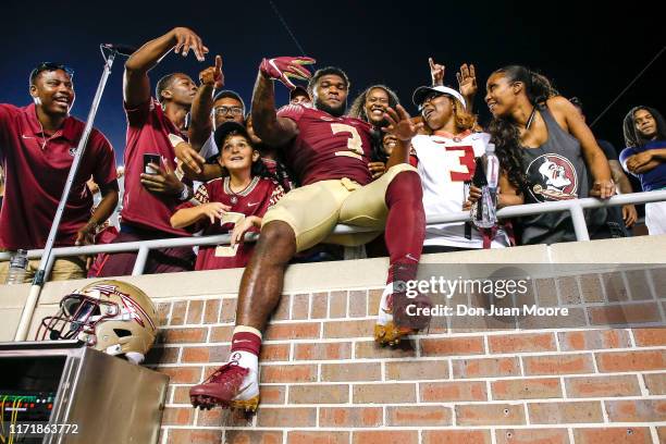 Runningback Cam Akers of the Florida State Seminoles with family and friends in the stands after the game against the North Carolina State Wolfpack...