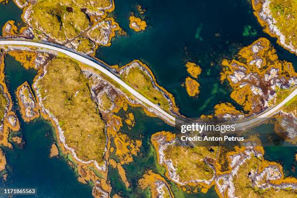 aerial view of beautiful road with bridge on the island smola, norway. - single track stockfoto's en -beelden
