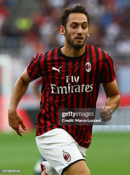 Hakan Calhanoglu of AC Milan looks on during the Serie A match between AC Milan and Brescia Calcio at Stadio Giuseppe Meazza on September 1, 2019 in...