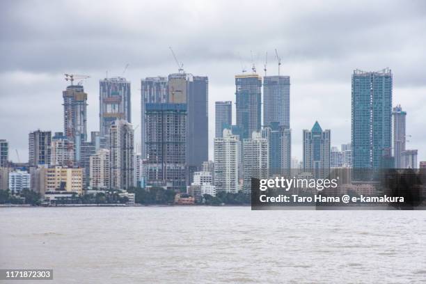 city buildings by the bay in mumbai city in maharashtra of india - mumbai skyline stock pictures, royalty-free photos & images