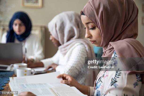 arab friends studying together at home - islamic school stock pictures, royalty-free photos & images