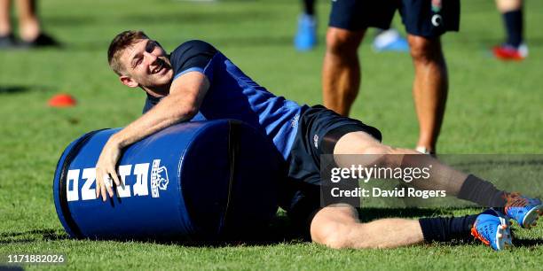 Ruaridh McConnochie dives onto a weight bag during the England training session held on September 03, 2019 in Treviso, Italy.