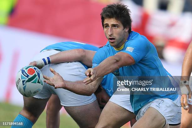 Uruguay's scrum-half Santiago Arata passes the ball during the Japan 2019 Rugby World Cup Pool D match between Georgia and Uruguay at the Kumagaya...