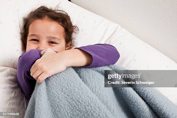 little girl hiding behind blanket - blanket stock pictures, royalty-free photos & images