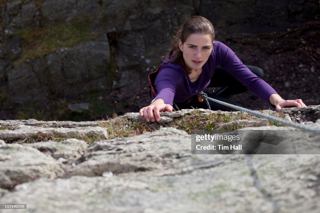 Woman absailing with lake below
