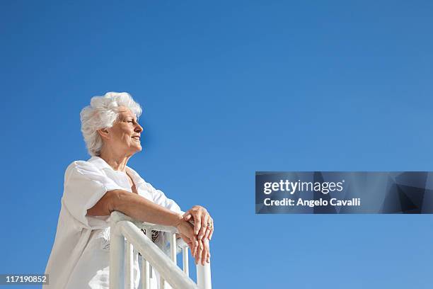 senior woman on the beach - old angelo stock pictures, royalty-free photos & images