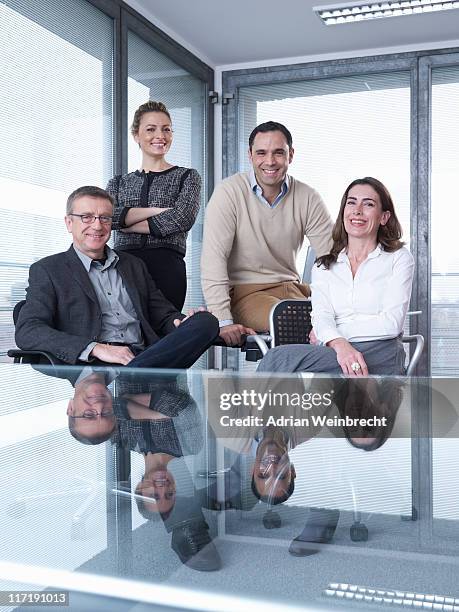 group meeting - group of businesspeople standing low angle view stock pictures, royalty-free photos & images