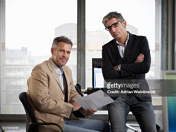 two men in a meeting - physical stance stock pictures, royalty-free photos & images