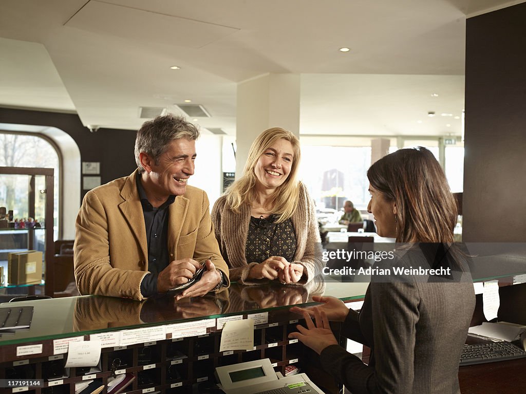 Senior Couple Checking into a Hotel